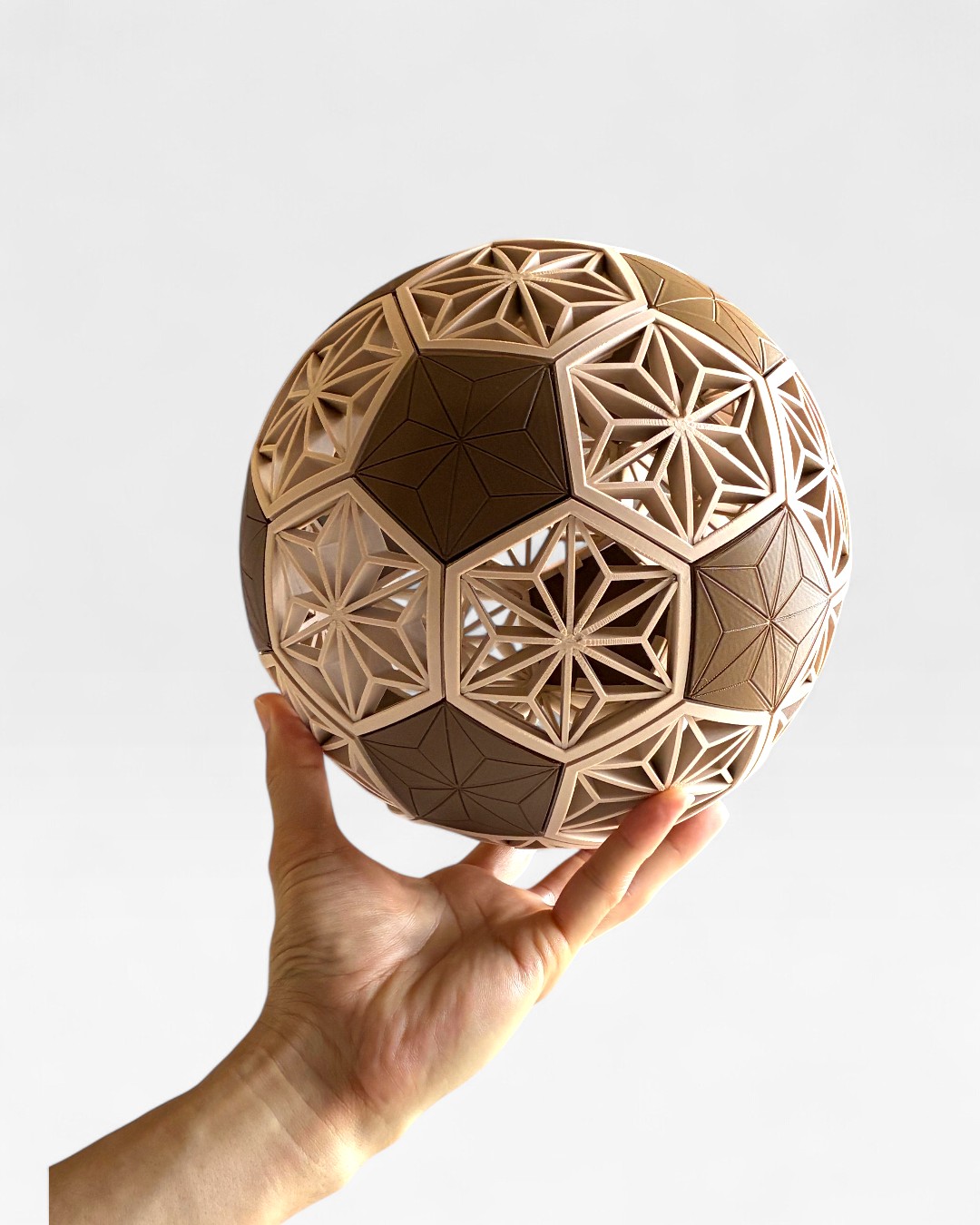 KUMIKO Soccer Ball prototype held by hand